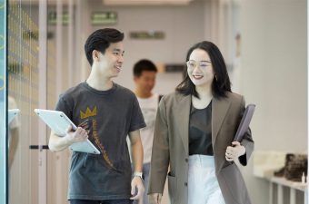 Students walking IE Tower|
