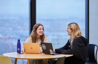 Girls talking Madrid campus|Students in study booth madrid tower|Students in IE Tower classroom