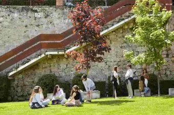 Student in segovia campus green space