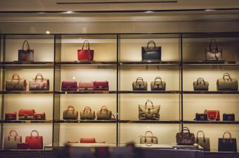 luxury brand marketing display case with purses