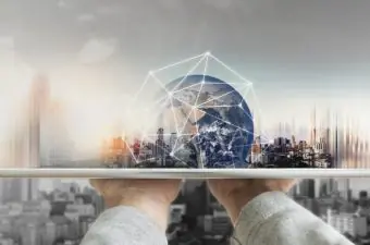 Hand,Holding,Digital,Tablet,With,Global,Network,Connection,Technology,And